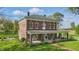 Beautiful exterior shot of the home with large front yard and inviting front porch with seating at 1901 S Old State Road 67, Paragon, IN 46166