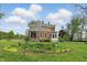 Charming brick home with a well-maintained garden and front porch at 1901 S Old State Road 67, Paragon, IN 46166