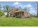 Spacious brick home with a wrap-around porch, perfect for outdoor enjoyment at 1901 S Old State Road 67, Paragon, IN 46166