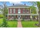 Beautiful brick two-story home boasting a covered front porch with classic architectural details at 1901 S Old State Road 67, Paragon, IN 46166