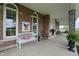 Inviting front porch with comfortable seating and detailed brickwork at 1901 S Old State Road 67, Paragon, IN 46166