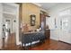 Hallway featuring exposed brick, hardwood floors, and a vintage dresser at 1901 S Old State Road 67, Paragon, IN 46166