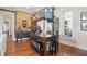 Well-lit kitchen featuring an island, exposed brick wall, and stainless steel pot rack at 1901 S Old State Road 67, Paragon, IN 46166