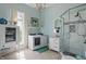 A stylish laundry and bathroom featuring modern washer and dryer, a glass shower, and elegant fixtures at 1901 S Old State Road 67, Paragon, IN 46166