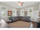 Cozy living room featuring a large sectional couch, ceiling fan, and ample natural light at 1901 S Old State Road 67, Paragon, IN 46166
