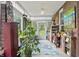 Sunroom with brick walls, tile floor, lots of plants, and windows at 1901 S Old State Road 67, Paragon, IN 46166