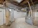 Basement with concrete walls, heater, and water heater at 270 W Broadway St, Shelbyville, IN 46176