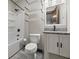 Well-lit bathroom featuring modern fixtures, granite counters and a shower-tub combo at 270 W Broadway St, Shelbyville, IN 46176