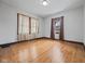 A spacious bedroom featuring hardwood floors and natural light from windows at 270 W Broadway St, Shelbyville, IN 46176