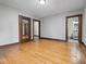 Neutral room with wood floor that could be a bedroom, office, or den at 270 W Broadway St, Shelbyville, IN 46176