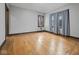A spacious bedroom featuring gleaming hardwood floors and large windows at 270 W Broadway St, Shelbyville, IN 46176
