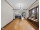 Spacious dining room opens to a renovated kitchen, showcasing hardwood floors and abundant natural light at 270 W Broadway St, Shelbyville, IN 46176
