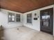 Covered front porch with white brick and a stained-glass window door offers curb appeal at 270 W Broadway St, Shelbyville, IN 46176