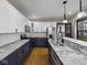 Updated kitchen featuring granite countertops, stainless steel appliances, and a convenient breakfast bar at 270 W Broadway St, Shelbyville, IN 46176
