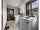 Bright laundry room featuring modern washer and dryer units and ample natural light at 270 W Broadway St, Shelbyville, IN 46176