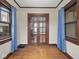Cozy living room boasts hardwood floors, natural light from the windows, and charming architectural details at 270 W Broadway St, Shelbyville, IN 46176