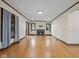 Spacious living room with hardwood floors and fireplace with lots of natural light and neutral paint at 270 W Broadway St, Shelbyville, IN 46176