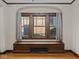Charming window seat with storage, framed by a large window, offering a cozy spot to relax and enjoy natural light at 270 W Broadway St, Shelbyville, IN 46176