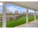 Picturesque view of the backyard and pond from the covered patio, offering a tranquil and scenic outdoor space at 2736 Victory Dr, Columbus, IN 47203
