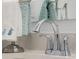 Bathroom detail showcasing chrome fixtures and decorative towels on a quartz countertop at 2736 Victory Dr, Columbus, IN 47203