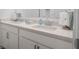 Bright bathroom with double sinks, a quartz countertop, and modern fixtures at 2736 Victory Dr, Columbus, IN 47203