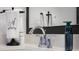 Close-up of sink with chrome fixtures, decorative towels, and stylish countertops in the modern bathroom at 2736 Victory Dr, Columbus, IN 47203