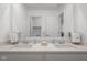 Bathroom featuring double sinks, a large mirror, and plenty of counter space at 2736 Victory Dr, Columbus, IN 47203
