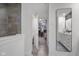 Hallway with access to the shower, walk-in closet and bathroom vanity at 2736 Victory Dr, Columbus, IN 47203
