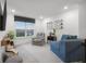 Cozy loft area features comfortable seating, decorative mirrors, and bright natural light from the windows at 2736 Victory Dr, Columbus, IN 47203