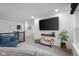 Upstairs loft features a large TV, stylish decor, and comfortable seating for a relaxing entertainment space at 2736 Victory Dr, Columbus, IN 47203