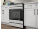 Modern stainless steel oven integrated into sleek white kitchen cabinetry at 2736 Victory Dr, Columbus, IN 47203