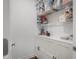Walk-in pantry with wire shelving, white cabinets and laminate flooring at 2736 Victory Dr, Columbus, IN 47203