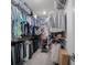 Spacious walk-in closet with organized shelving, hanging rods, clothing, and storage at 2736 Victory Dr, Columbus, IN 47203