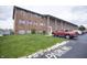 Brick apartment building with parking and green space at 3004 Lake Shore Dr # E, Indianapolis, IN 46205