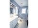Full bathroom with tile floors, a white vanity, toilet, and shower at 3004 Lake Shore Dr # E, Indianapolis, IN 46205