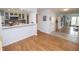 Modern open-concept kitchen offers a breakfast bar and hardwood floors and seamlessly connects to the living area at 3004 Lake Shore Dr # E, Indianapolis, IN 46205