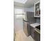 This updated kitchen features stainless steel appliances and sleek gray cabinetry at 3004 Lake Shore Dr # E, Indianapolis, IN 46205