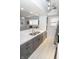 This kitchen with stainless appliances features an island with a sink, offering a functional workspace at 3004 Lake Shore Dr # E, Indianapolis, IN 46205
