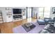 Open-concept living room with built-in shelving, hardwood floors, and plenty of space to relax at 3004 Lake Shore Dr # E, Indianapolis, IN 46205