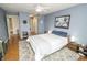 Spacious main bedroom featuring an ensuite, ceiling fan, and natural light at 3004 Lake Shore Dr # E, Indianapolis, IN 46205