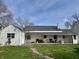 Spacious backyard featuring a well-maintained lawn and a covered patio area at 323 E Adams St, Franklin, IN 46131