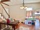 Comfortable dining space with hardwood floors and view into kitchen at 323 E Adams St, Franklin, IN 46131