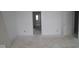 Bright, unfinished bedroom with freshly painted white walls, doors and baseboards at 3941 Highcrest Rd, Indianapolis, IN 46239