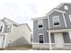 Two-story homes with gray and white siding with classic design at 3941 Highcrest Rd, Indianapolis, IN 46239