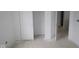 Hallway in unfinished home with fresh white paint and baseboards at 3941 Highcrest Rd, Indianapolis, IN 46239