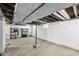 Unfinished basement with concrete floor and cinder block walls, offering potential for customization at 422 N Oxford St, Indianapolis, IN 46201