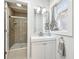 Updated bathroom with glass enclosed shower, modern vanity, and neutral tones at 422 N Oxford St, Indianapolis, IN 46201