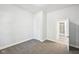 A bright bedroom featuring neutral walls, grey carpeting, and a closet at 422 N Oxford St, Indianapolis, IN 46201