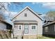 Cozy home with gray siding, a well-maintained yard, and a classic American architectural style at 422 N Oxford St, Indianapolis, IN 46201