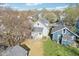 Aerial view of a well-maintained two-story home with a detached garage and spacious backyard at 422 N Oxford St, Indianapolis, IN 46201